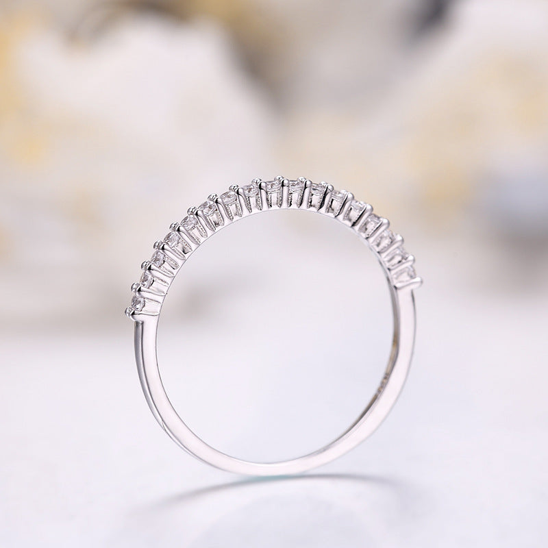 Single row diamond zircon ring